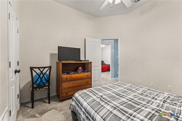 bedroom with light colored carpet, visible vents, and ceiling fan