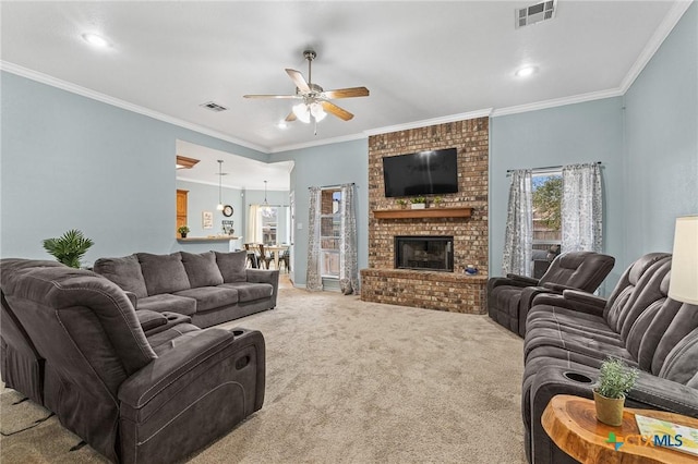 carpeted living area featuring visible vents, a fireplace, and ornamental molding