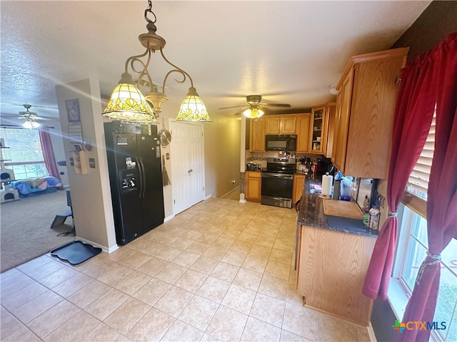 kitchen with ceiling fan, light tile patterned floors, black appliances, and decorative light fixtures