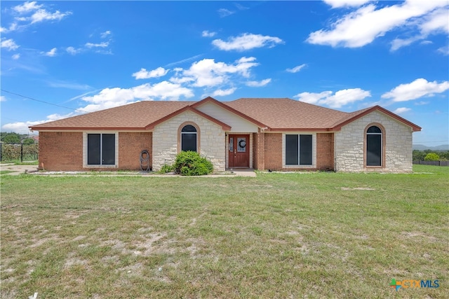 ranch-style house with a front yard