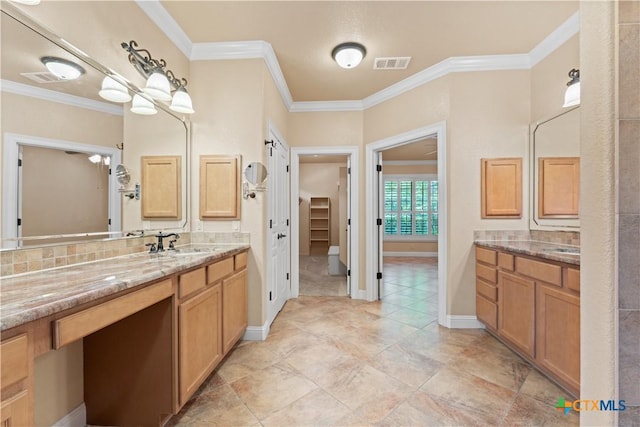 full bathroom with ornamental molding, visible vents, baseboards, and vanity