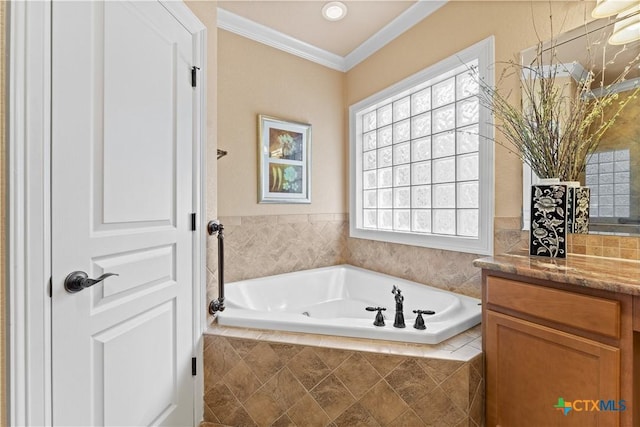 bathroom featuring a bath, crown molding, and vanity