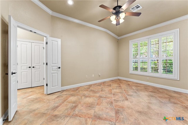 spare room featuring visible vents, baseboards, ornamental molding, and ceiling fan