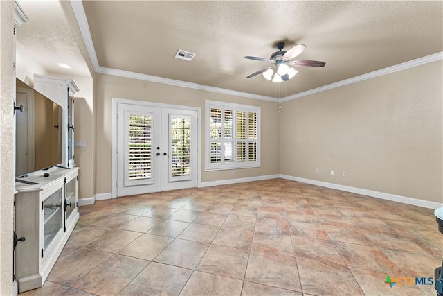 unfurnished room with ornamental molding, french doors, and a ceiling fan