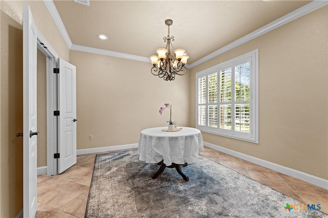 dining room featuring a notable chandelier, ornamental molding, and baseboards