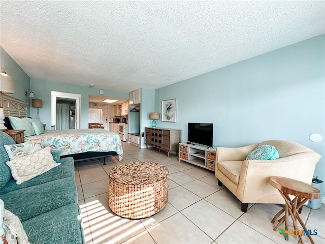 407 Beach Ave Unit 111, Port Aransas, TX 78373 - living area with light tile patterned floors and a textured ceiling