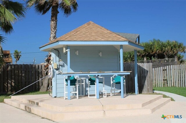 view of front of property featuring a patio and a gazebo