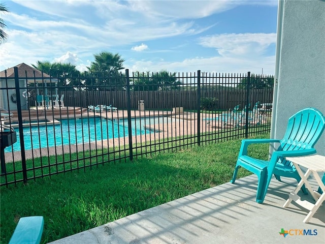 407 Beach Ave Unit 111, Port Aransas, TX 78373 - community pool featuring a patio