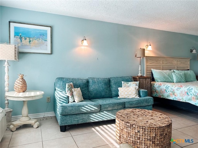 407 Beach Ave Unit 111, Port Aransas, TX 78373 - bedroom featuring tile patterned floors and a textured ceiling