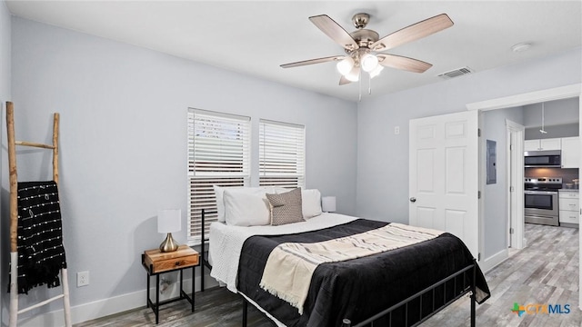 bedroom featuring ceiling fan and light wood-type flooring