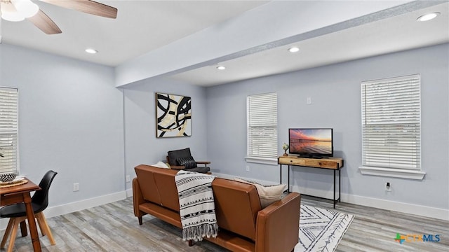 office with ceiling fan and light wood-type flooring