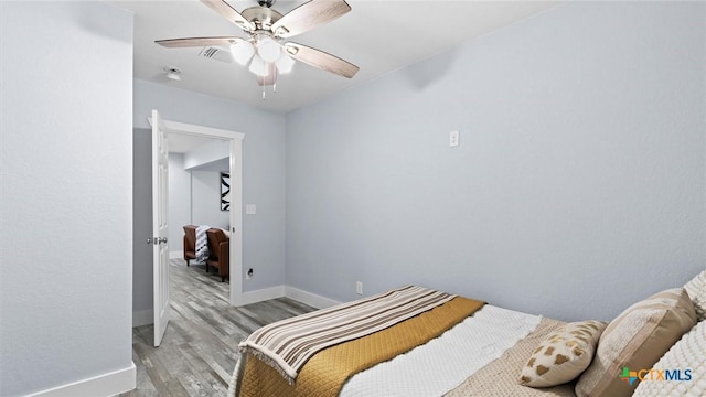 bedroom featuring ceiling fan and light hardwood / wood-style floors