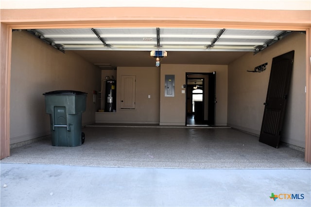 garage featuring a garage door opener, electric panel, and water heater