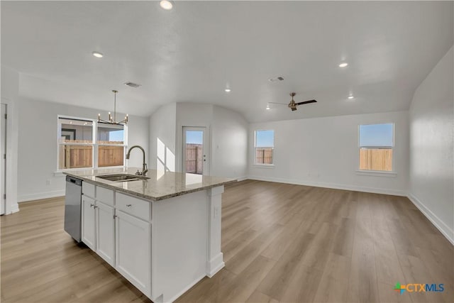 kitchen with sink, decorative light fixtures, a center island with sink, stainless steel dishwasher, and white cabinets