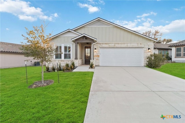 view of front of property featuring a garage and a front yard