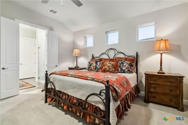 carpeted bedroom featuring lofted ceiling and ceiling fan