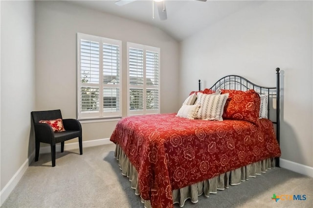 bedroom featuring ceiling fan, lofted ceiling, and light carpet