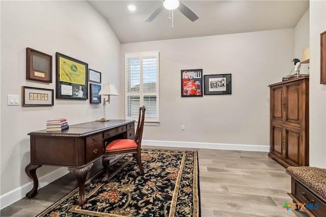 office space with ceiling fan, lofted ceiling, and light hardwood / wood-style flooring