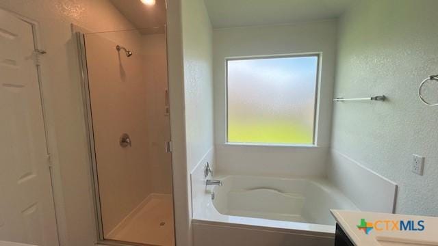 249 Bethann Dr, Temple, TX 76502 - full bathroom with vanity, a stall shower, and a bath