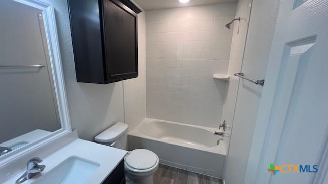 249 Bethann Dr, Temple, TX 76502 - bathroom with wood finished floors, vanity, and shower / washtub combination