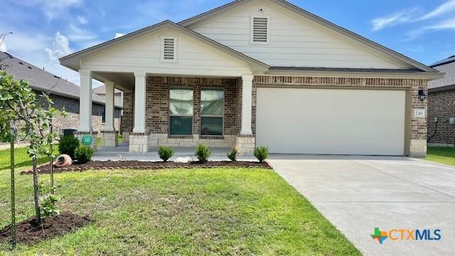 249 Bethann Dr, Temple, TX 76502 - view of front of home with a porch, brick siding, a garage, concrete driveway, and a front lawn