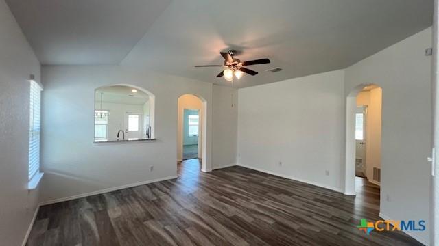 249 Bethann Dr, Temple, TX 76502 - unfurnished living room featuring dark wood finished floors, a ceiling fan, and plenty of natural light