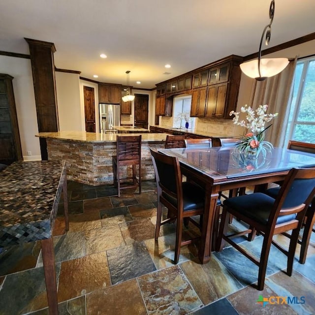 dining room with crown molding