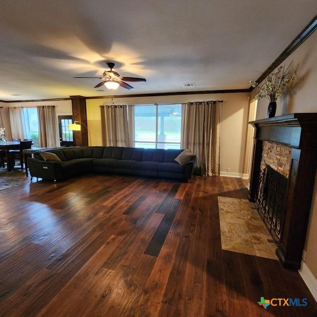 11710 Uplands Ridge Dr, Austin, TX 78738 - living area featuring hardwood / wood-style flooring, healthy amount of natural light, a fireplace, and crown molding