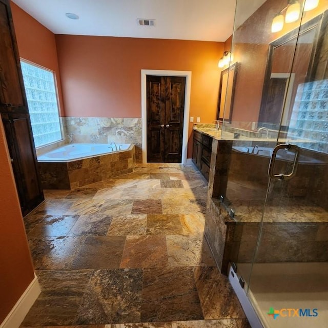 11710 Uplands Ridge Dr, Austin, TX 78738 - bathroom with a bath, a stall shower, stone tile floors, and vanity
