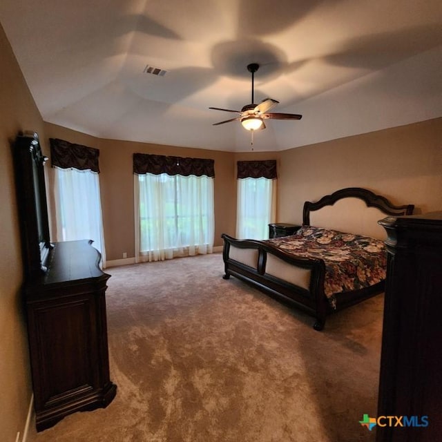 bedroom featuring ceiling fan, lofted ceiling, and carpet flooring