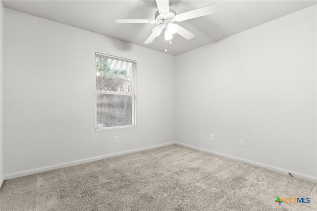 spare room with ceiling fan and carpet floors