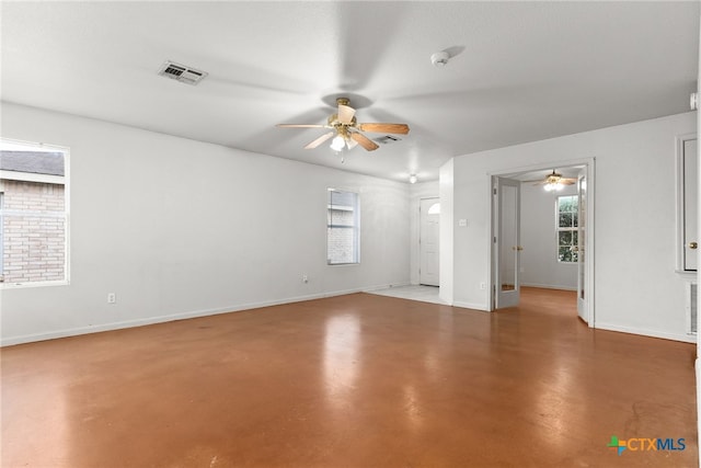 unfurnished room featuring concrete floors