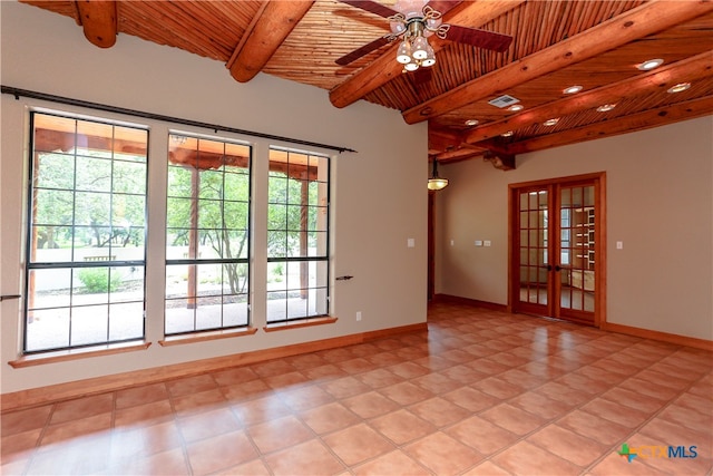 tiled spare room with french doors, beamed ceiling, ceiling fan, and wood ceiling