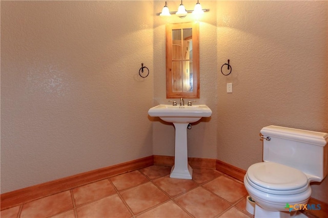 9776 Arroyo Dr, Belton, TX 76513 - bathroom featuring toilet, tile patterned flooring, and baseboards