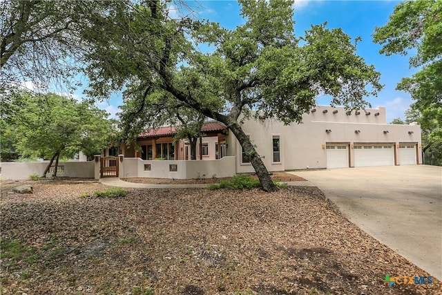 9776 Arroyo Dr, Belton, TX 76513 - southwest-style home with a garage, driveway, and stucco siding