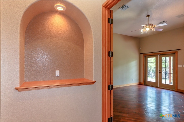 entryway with dark wood-type flooring, ceiling fan, and french doors