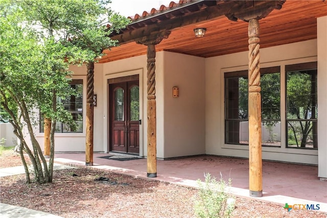 9776 Arroyo Dr, Belton, TX 76513 - entrance to property with stucco siding, french doors, and a tile roof