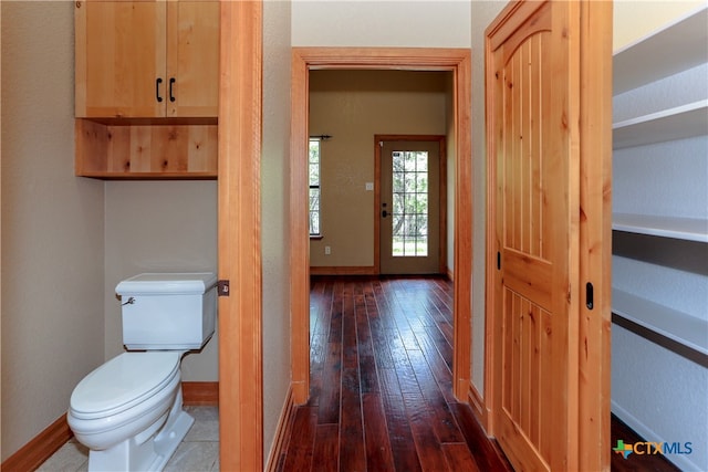 bathroom featuring hardwood / wood-style flooring and toilet