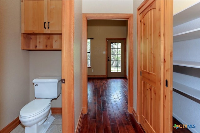 9776 Arroyo Dr, Belton, TX 76513 - bathroom featuring hardwood / wood-style flooring, toilet, and baseboards