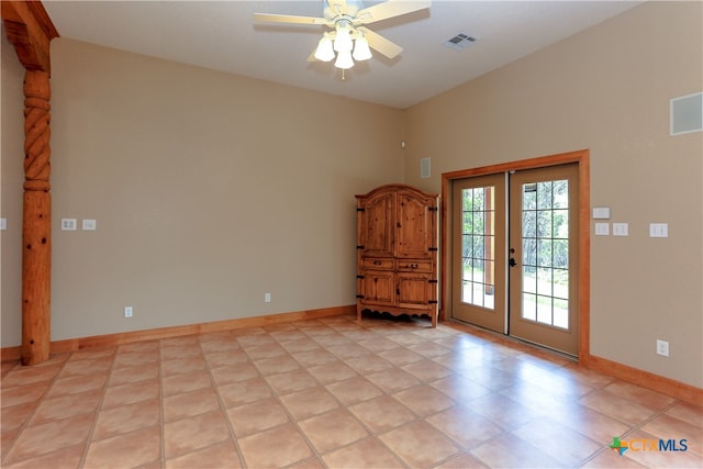 foyer with french doors, ceiling fan, and light tile patterned flooring