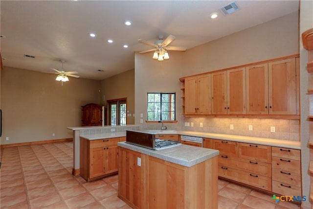 9776 Arroyo Dr, Belton, TX 76513 - kitchen with ceiling fan, light brown cabinets, backsplash, tile countertops, and recessed lighting
