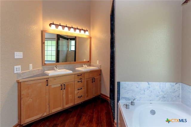 9776 Arroyo Dr, Belton, TX 76513 - bathroom with a textured wall, hardwood / wood-style floors, a bath, double vanity, and a shower