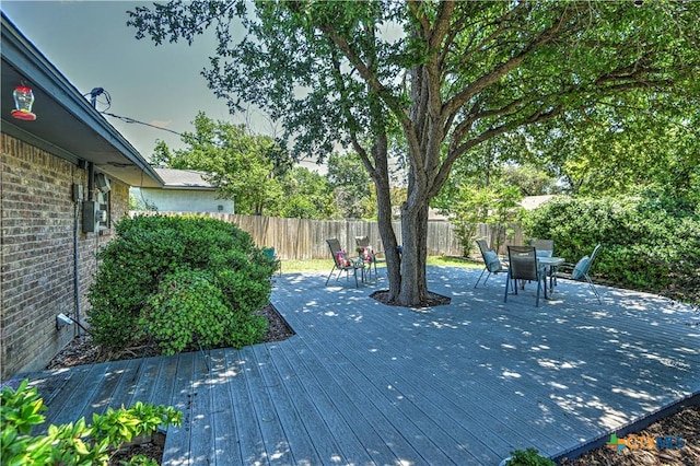 4701 Hickory Rd, Temple, TX 76502 - wooden terrace with a fenced backyard and outdoor dining area