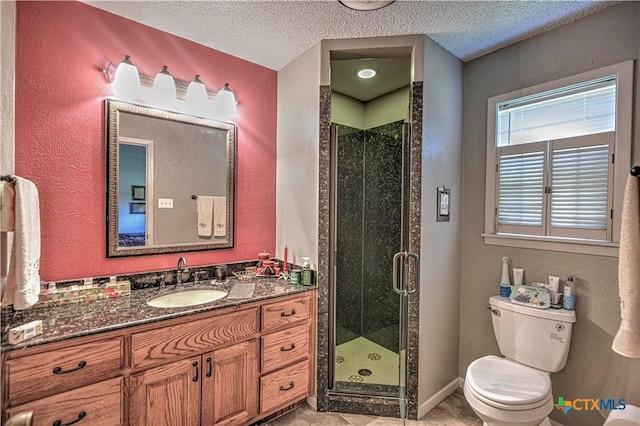 4701 Hickory Rd, Temple, TX 76502 - bathroom featuring toilet, vanity, a shower stall, a textured ceiling, and a textured wall