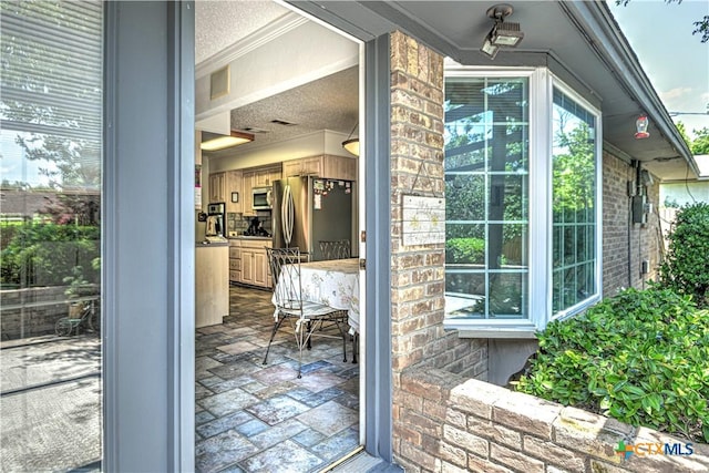 4701 Hickory Rd, Temple, TX 76502 - doorway to property featuring brick siding
