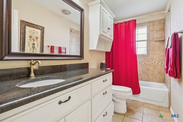 bathroom featuring tile patterned flooring, vanity, toilet, and shower / bath combo