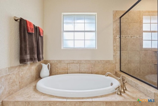 bathroom with a garden tub