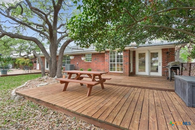 wooden terrace featuring grilling area