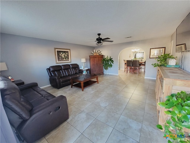 living room featuring ceiling fan and light tile patterned flooring