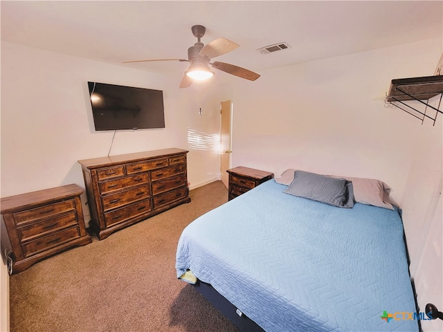 bedroom featuring ceiling fan and carpet floors